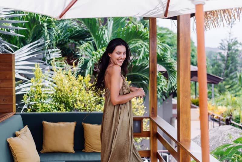 Woman enjoying a luxury villa surrounded by lush greenery – Bohari